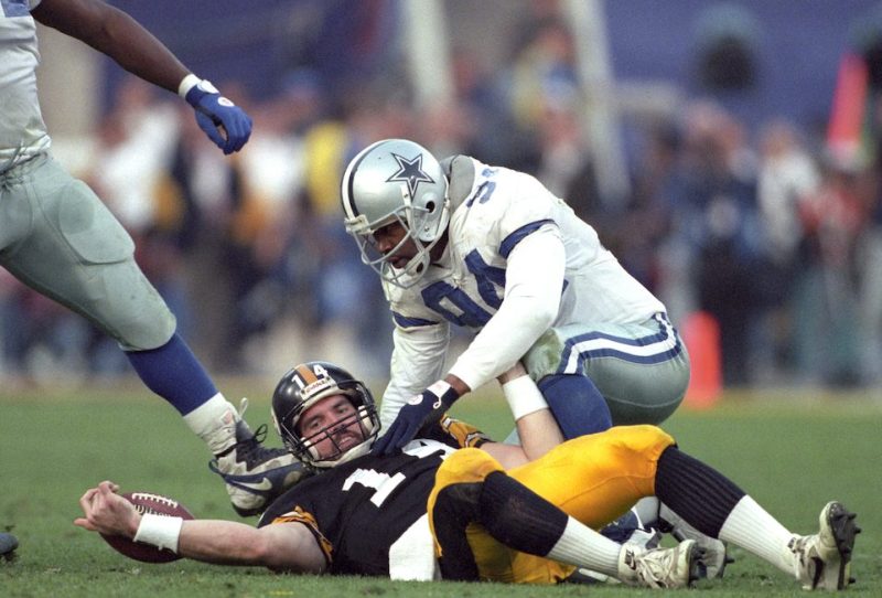 Football: Super Bowl XXX: Dallas Cowboys Charles Haley (94) kneeling over Pittsburgh Steelers QB Neil O'Donnell (14) after sack at Sun Devil Stadium. Tempe, AZ 1/28/1996 CREDIT: Walter Iooss Jr. (Photo by Walter Iooss Jr. /Sports Illustrated/Getty Images) (Set Number: X50007 TK2 R3 F17 )