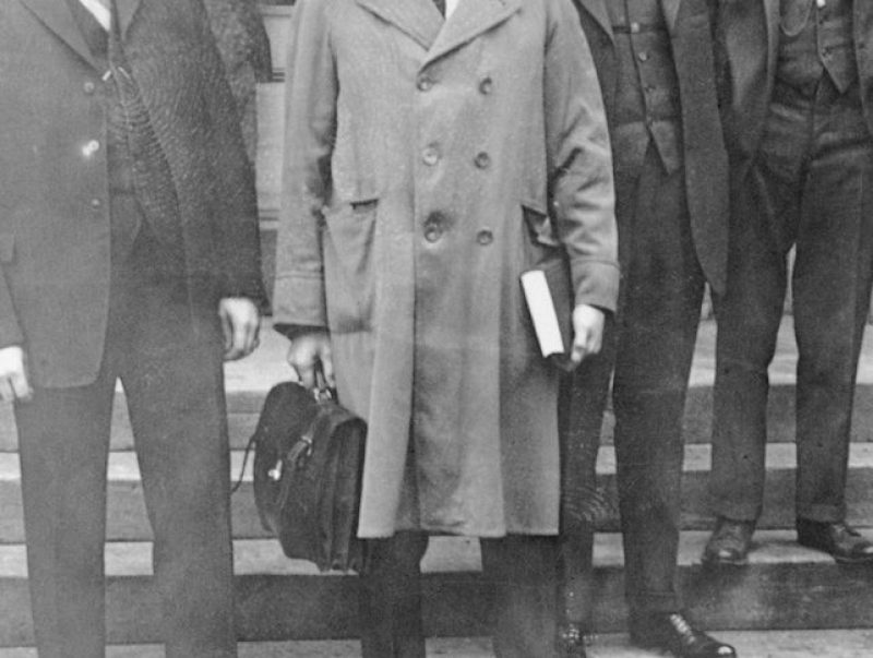 (Original Caption) Noblesville, Indiana: Trial Of Former Klan Dragon D. C. Stephenson, the former Grand Dragon of "The KKK" is shown at courthouse where he will be tried for the death of Miss Madge Oberholtzer. Left to right, Sheriff Charles Gooding; Earl Gentry, Defendant; Attorney Ira M. Holmes; D. C. Stephenson, Defendant; Attorney Ralph Waltz; and Earl Klenck, Defendant.