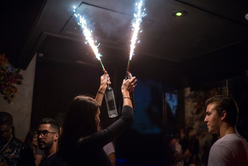 Wildflower nightclub makes a spectacle when someone orders bottle service, a server will bring out the bottle with a sparkle stuck in the neck and will proceed to dance at the table. The average bottle service costs $250 at nightclubs in the area. (Brian B. Bettencourt/Toronto Star via Getty Images)