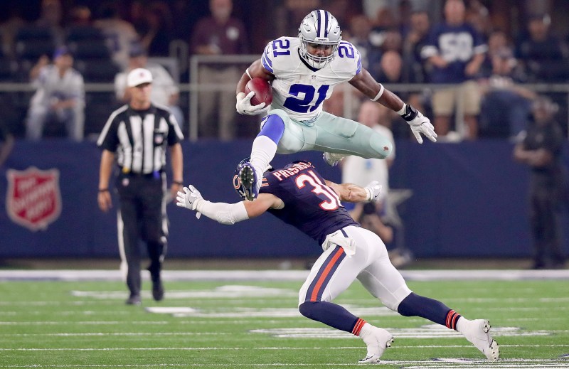 Ezekiel Elliott #21 of the Dallas Cowboys hurdles Chris Prosinski #31 of the Chicago Bears while carrying the ball in the fourth quarter at AT&T Stadium on September 25, 2016 in Arlington, Texas. (Tom Pennington/Getty Images)