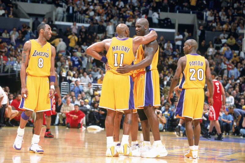 LOS ANGELES - APRIL 1: Shaquille O'Neal #34 of the Los Angeles Lakers talks with Karl Malone #11 during the game against the Houston Rockets at the Staples Center on April 1, 2004 in Los Angeles, California. The Lakers won 93-85. NOTE TO USER: User expressly acknowledges and agrees that, by downloading and/or using this Photograph, User is consenting to the terms and conditions of the Getty Images License Agreement. (Photo by Andrew D. Bernstein/NBAE via Getty Images)
