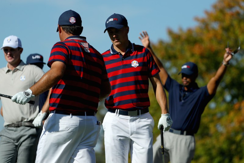 CHASKA, MN - OCTOBER 01: Patrick Reed and Jordan Spieth of the United States react on the eighth tee as vice-captain Tiger Woods looks on during afternoon fourball matches of the 2016 Ryder Cup at Hazeltine National Golf Club on October 1, 2016 in Chaska, Minnesota. (Photo by Scott Halleran/PGA of America via Getty Images)