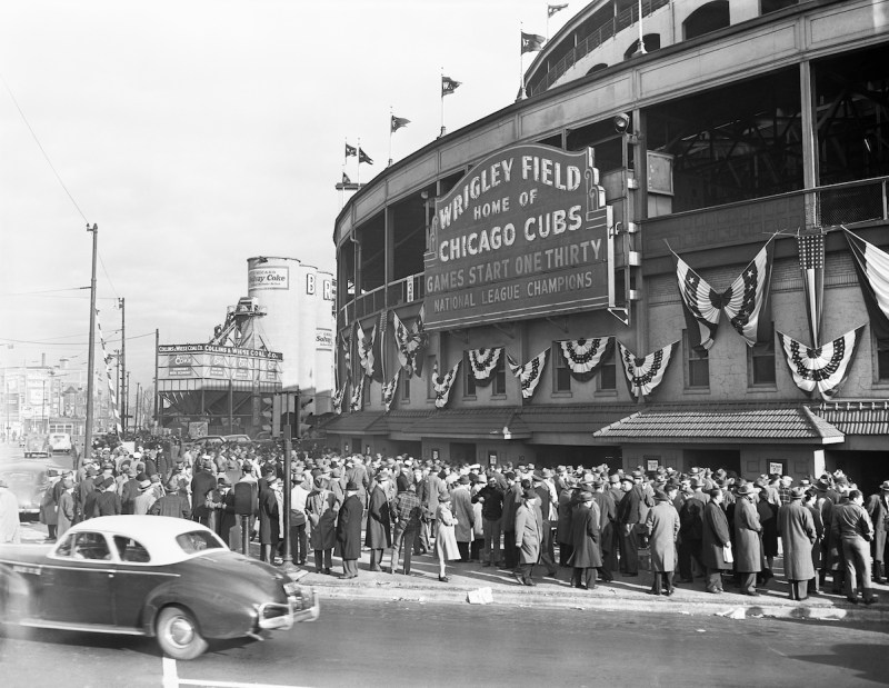 (Original Caption) 10/10/1945-Chicago, Illinois-Crowds of sports fans mill around the Wrigley Field Box Office where reserved seats for the final Tigers-Cubs World Series meet went on sale at 8 am, October 9th. Lines started forming at around 6 pm on the preceding day.