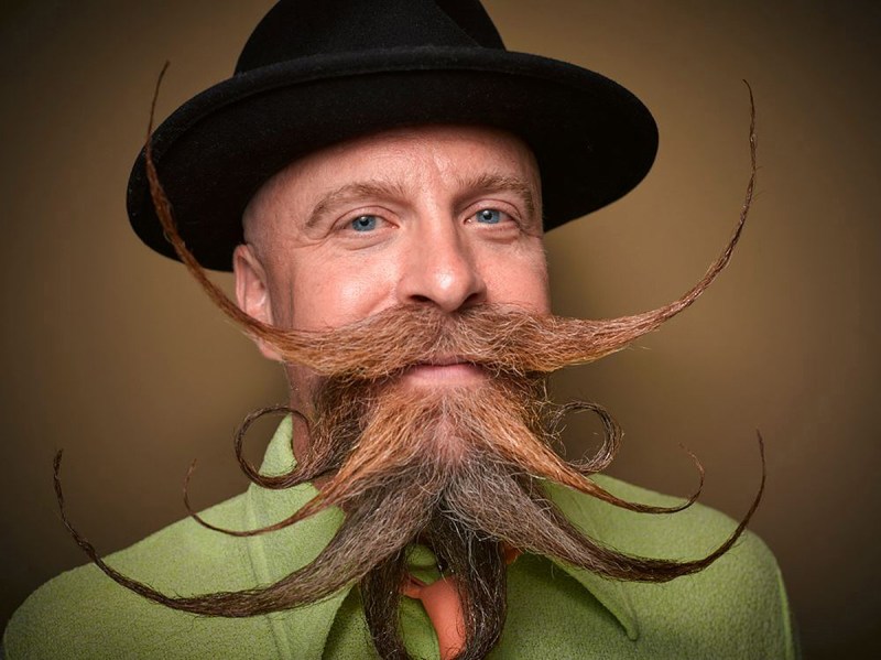 PIC BY GREG ANDERSON / CATERS NEWS - (PICTURED: James McMahon.) - Gents from around the world descended on Nashville earlier this month fighting for the title of best beard in the National Beard and Moustache Championship. The annual competition covers 17 categories in which the men can compete, ranging from freestyle, to natural, to facial hair inspired by icons such as Dali and the Musketeers. With the competition as stiff as the waxed moustaches, competitors had to go beard to beard to decide whose facial fuzz was the most fan-TASH-tic. Competitors were judged on their overall appearance, style and personality, with judges also considering originality and creativity in the freestyle categories. Contestants certainly rose to the challenge with perfectly curled beards and also more outrageous statement styles, such as a Tim Burton themed beard, and a beard styled to look like a beak. - SEE CATERS COPY