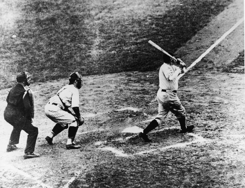 Legendary American baseball player Babe Ruth (1895 - 1948) of the New York Yankees hits a home run in the third game of the World Series against the Chicago Cubs at Wrigley Field, Chicago, October 1, 1932. It was during this game that Ruth gestured with his bat before hitting a home run giving birth to the legend of the 'Called Shot.' (Photo by B. Bennett/Getty Images)