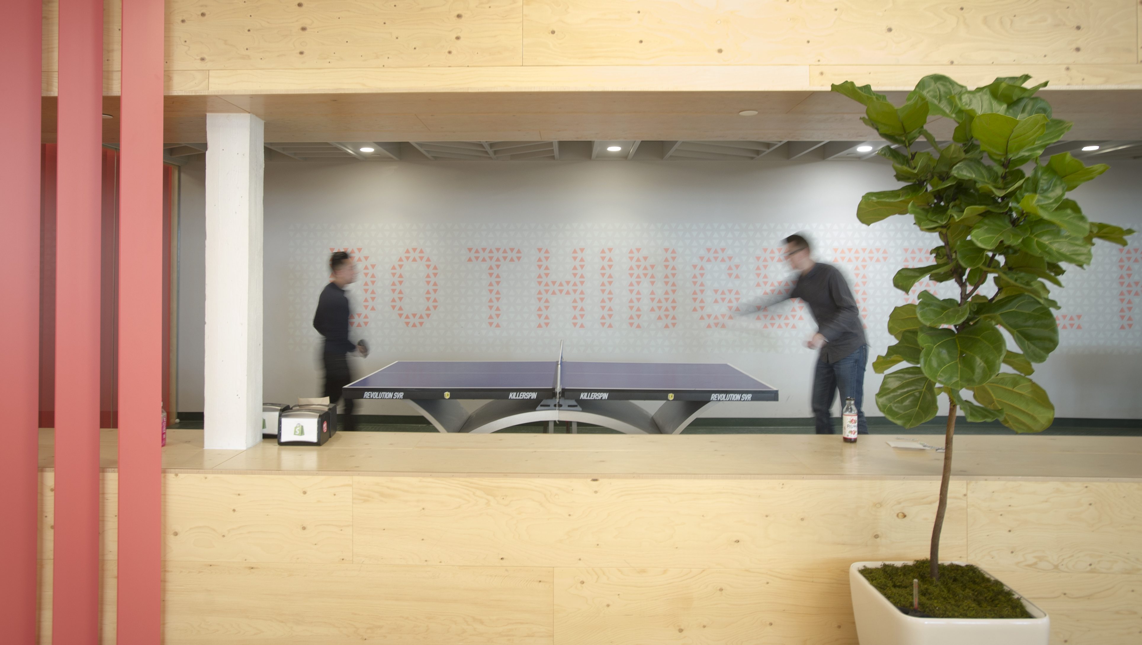 Employees of Shopify Inc. play ping-pong at their company's office space in Toronto, Ontario, Canada, on March 13, 2015. Rents for brick-and-beam real estate in the city's east end rose 26 percent to C$20.62 ($16.13) a square foot from 2007 and were up 49 percent in the west end, according to data compiled by CBRE Group Inc. (Kevin Van Paassen/Bloomberg via Getty Images)