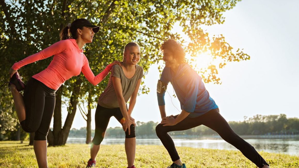 Close up of a friends stretching after a run (Getty Images)