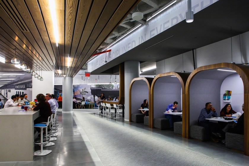 Employees work at JPMorgan Chase & Co.'s. new technology hub across the street from the Hudson Yards development on Manhattans West Side in New York, U.S., on Monday, Feb. 22, 2016. The office has all the trappings of a startup: foosball tables, a game room, industrial decor and fridges stocked with sodas and snacks. This is still a bank, though. The uniform of the mostly male workforce is a button-down shirt and slacks. (Chris Goodney/Bloomberg via Getty Images)