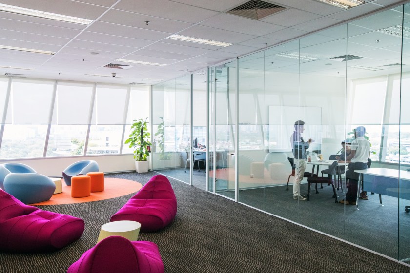 Employees attend a meeting at the Garena Interactive Holding Ltd. headquarters in Singapore, on Thursday, Aug. 25, 2016. (Nicky Loh/Bloomberg via Getty Images)