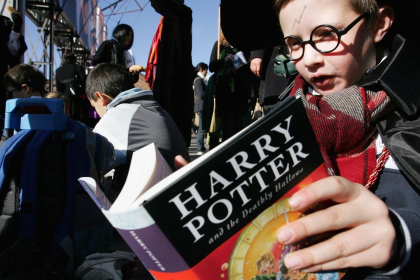 Harry Potter fans rush to read the opening lines of the new and final novel by author J.K. Rowling, "Harry Potter and the Deathly Hallows" during a fans day at The Carriage Works on July 21, 2007 in Sydney, Australia. (Lisa Maree Williams/Getty Images)