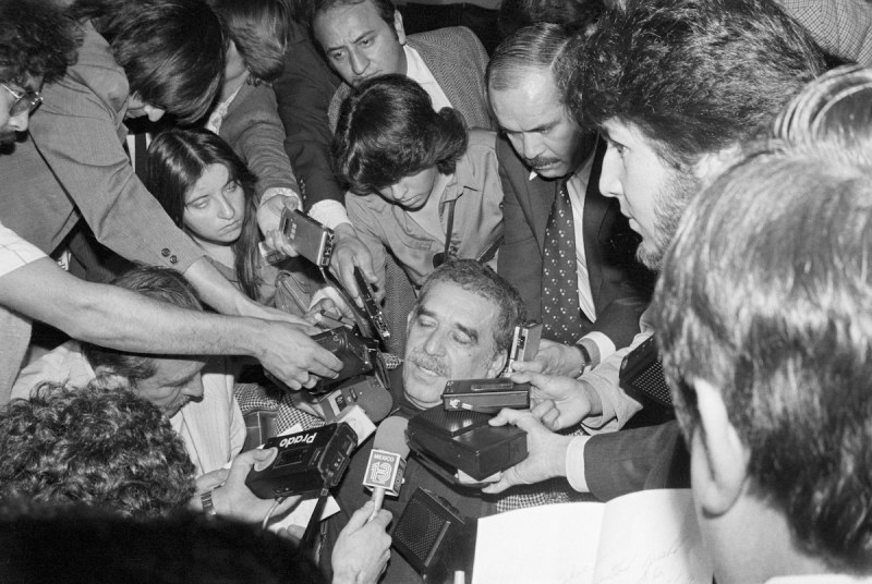 (Original Caption) 3/26/1981- Mexico City, Mexico: Colombian left-wing novelist Gabriel Garcia Marquez is surrounded by Mexican newsmen with tape recorders and microphones after his arrival at Mexico City's international airport, 3/26. Garcia Marquez is here because he fears arrest and interrogation by Colombian military officials but said he is not a political person.