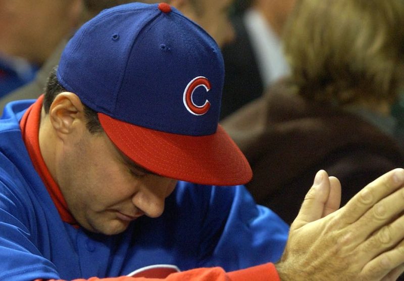 CHICAGO - OCTOBER 15: An fan waits for the final outs between the Florida Marlins and the Chicago Cubs during game seven of the National League Championship Series October 15, 2003 at Wrigley Field in Chicago, Illinois. The marlins defeated the Cubs 9-6. (Photo by Jonathan Daniel/Getty Images)