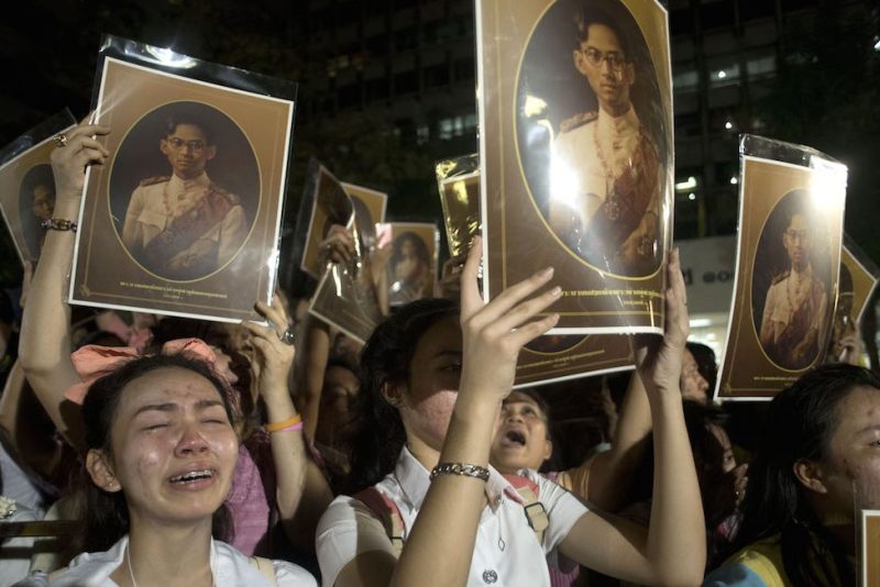 BANGKOK, THAILAND - OCTOBER 13: People mourn after learning of the death of Thailand's King Bhumibol Adulyadej on October 13, 2016 in Bangkok, Thailand. King Bhumibol, the world's longest reigning monarch, died at 88 in Bangkok's Siriraj Hospital on Thursday. (Photo by Borja Sanchez Trillo/Getty Images)