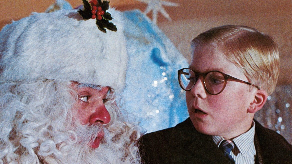 Peter Billingsley sits on Santa's lap in a scene from the film 'A Christmas Story', 1983. (Photo by Metro-Goldwyn-Mayer/Getty Images)