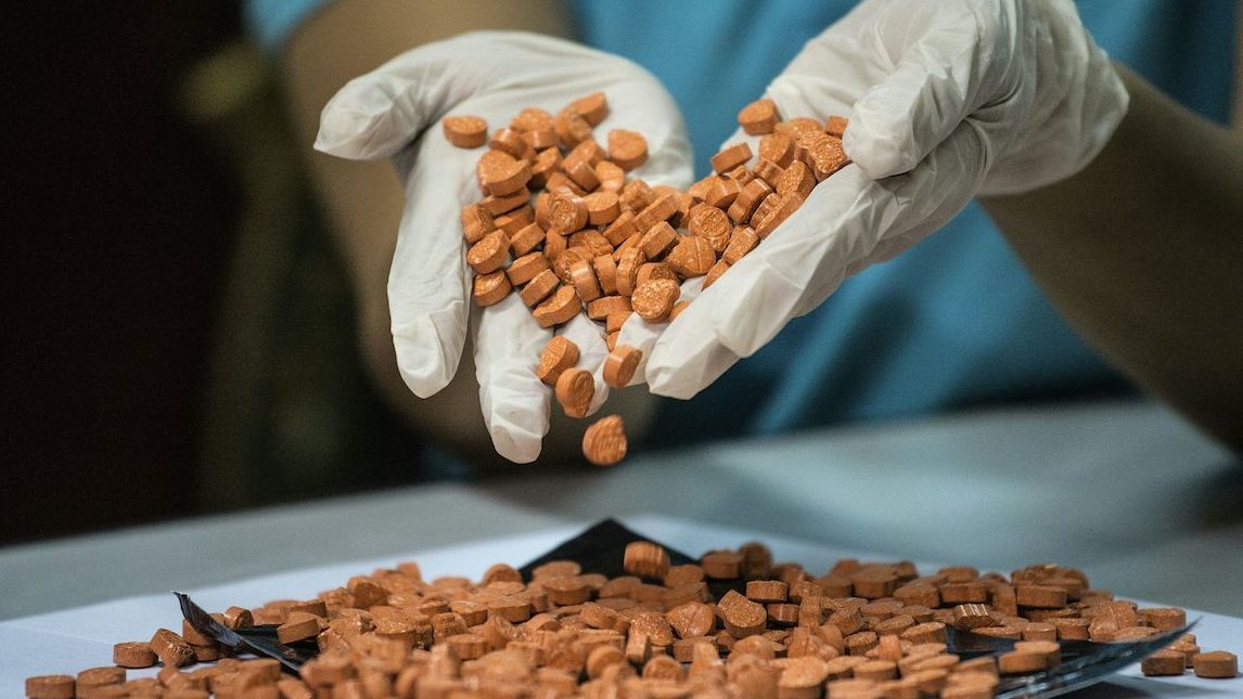 A Bureau of Customs (BOC) personnel displays confiscated illegal drugs, known Methylenedioxymethamphetamine (MDMA), commonly refered to as ecstasy, at a press conference at the BOC headquarters in Manila on September 14, 2016. / AFP / NOEL CELIS        (Photo credit should read NOEL CELIS/AFP/Getty Images)