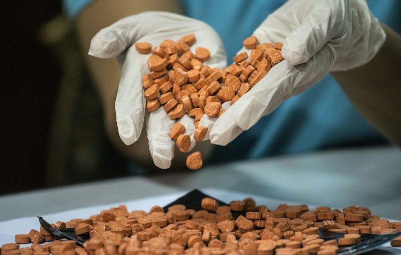 A Bureau of Customs (BOC) personnel displays confiscated illegal drugs, known Methylenedioxymethamphetamine (MDMA), commonly refered to as ecstasy, at a press conference at the BOC headquarters in Manila on September 14, 2016. / AFP / NOEL CELIS (Photo credit should read NOEL CELIS/AFP/Getty Images)