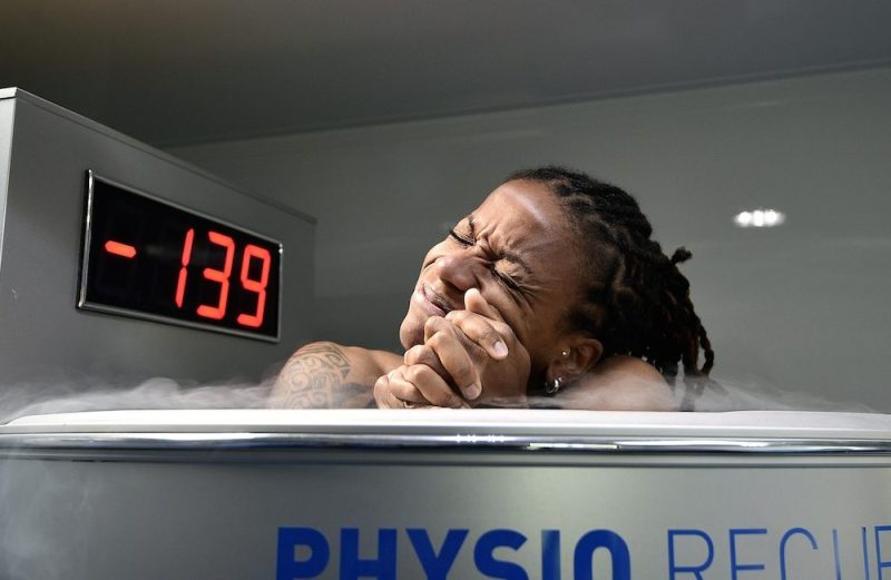 France's midfielder Elodie Thomis reacts as she undergoes treatment in a medical device used for cryotherapy at the French national football team training base in Clairefontaine-en-Yvelines, on May 11, 2015, during preparations for the upcoming FIFA 2015 Women's World Cup. AFP PHOTO / FRANCK FIFE --FRANCE OUT-- (Photo credit should read FRANCK FIFE/AFP/Getty Images)