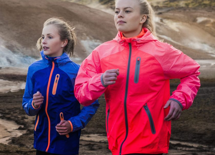 Friends running on mountain road in Iceland. (Portra Images/Getty Images)