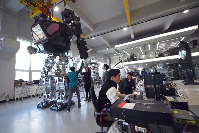 Engineers test a four-metre-tall humanoid manned robot dubbed Method-2 in a lab of the Hankook Mirae Technology in Gunpo, south of Seoul, on December 27, 2016. The giant human-like robot bears a striking resemblance to the military robots starring in the movie "Avatar" and is claimed as a world first by its creators from a South Korean robotic company. (JUNG YEON-JE/AFP/Getty Images)