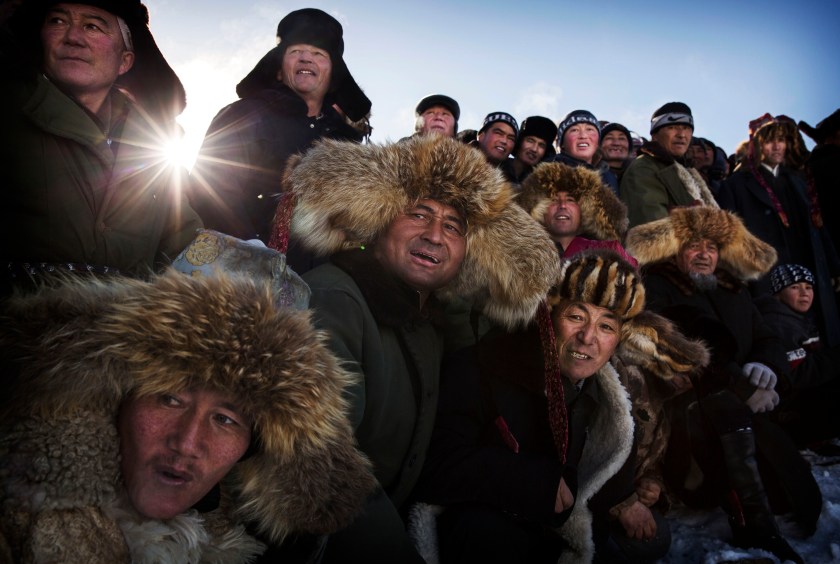 The Eagle Hunting festival, organized by the local hunting community, is part of an effort to promote and grow traditional hunting practices for new generations in the mountainous region of western China that borders Kazakhstan, Russia and Mongolia. The training and handling of the large birds of prey follows a strict set of ancient rules that Kazakh eagle hunters are preserving for future generations. (Kevin Frayer/2016 Sony World Photography Awards)