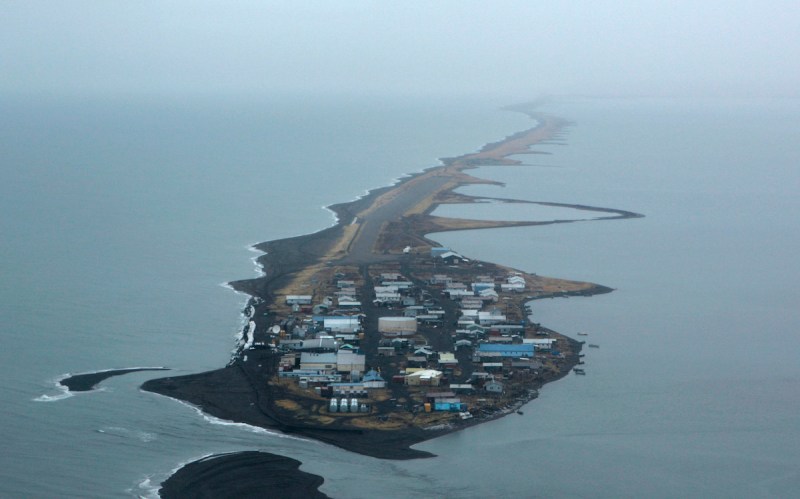 September 30, 2007. Kivalina, AK. From the air, Kivalina looks like a giant tadpole. The Chukchi Sea on the left is steadily eating away at the shorline. Some in the village of about 400 residents say it's global warming and the town must be moved before the sea washes it away. (Photo by Don Bartletti/Los Angeles Times via Getty Images)