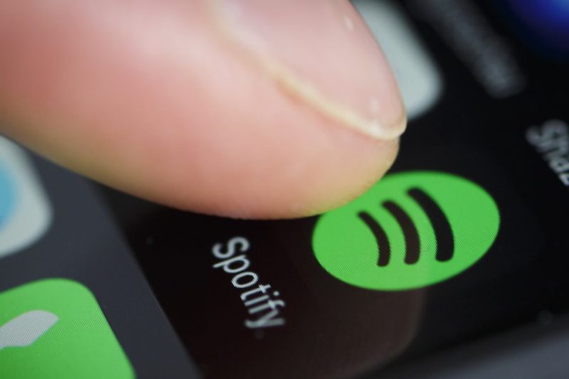 BERLIN, GERMANY - JANUARY 21: The Logo of streeming service Spotify is displayed on the screen of a smartphone on January 21, 2016 in Berlin, Germany. (Photo by Thomas Trutschel/Photothek via Getty Images)