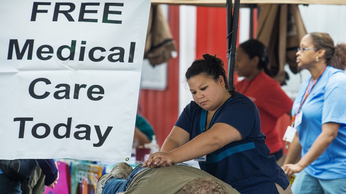 A patient receives treatment during the non-profit Remote Area Medical(RAM) clinic held at the county fairgrounds July 20 in Wise, Virginia. (AFP Photo/Paul J. Richards/GettyImages)