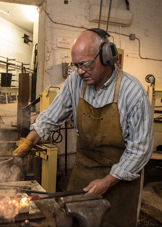 John Dittmeier, Blacksmith, performs a series of straightening and bending after using a power hammer. (April Greer/Washington Post/Getty Images)