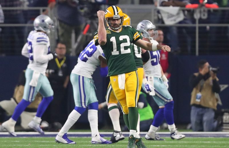 ARLINGTON, TX - JANUARY 15: Aaron Rodgers #12 of the Green Bay Packers celebrates after throwing a touchdown pass during the third quarter against the Dallas Cowboys in the NFC Divisional Playoff game at AT&T Stadium on January 15, 2017 in Arlington, Texas. (Photo by Tom Pennington/Getty Images)