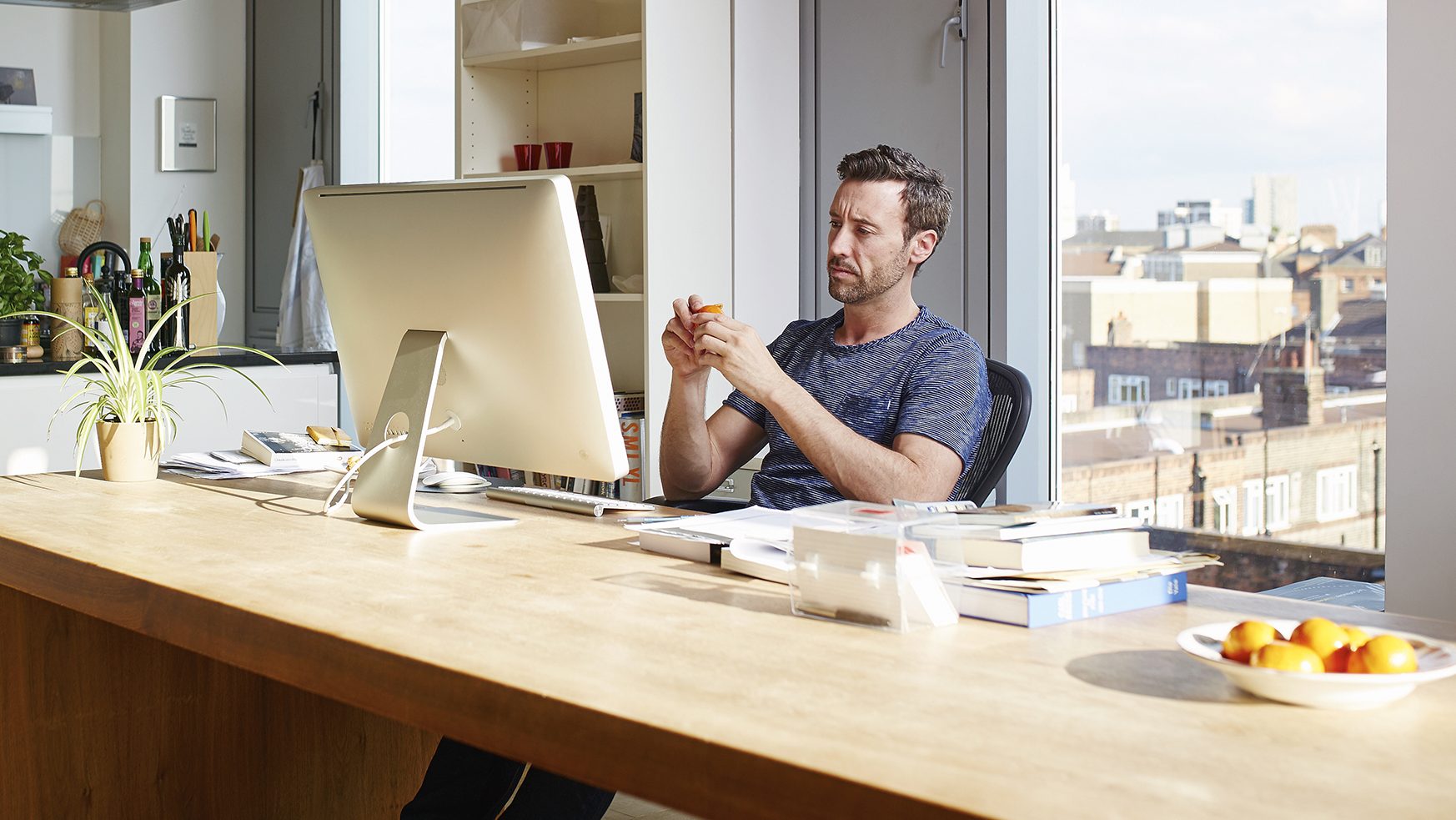 Man working alone in his apartment (Getty Images)