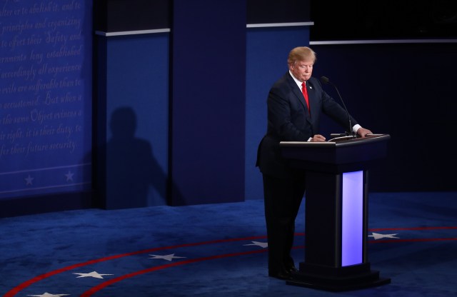 Donald Trump, 2016 Republican presidential nominee, writes notes during the third U.S. presidential debate in Las Vegas, Nevada, U.S., on Wednesday, Oct. 19, 2016. (Andrew Harrer/Bloomberg via Getty Images)