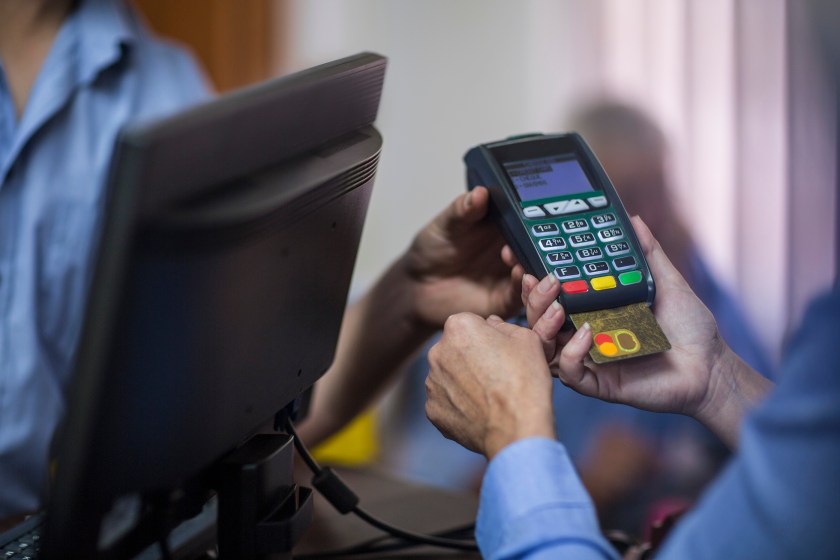 Cape Town, South Africa, customer using credit card reader at store (Getty Images)