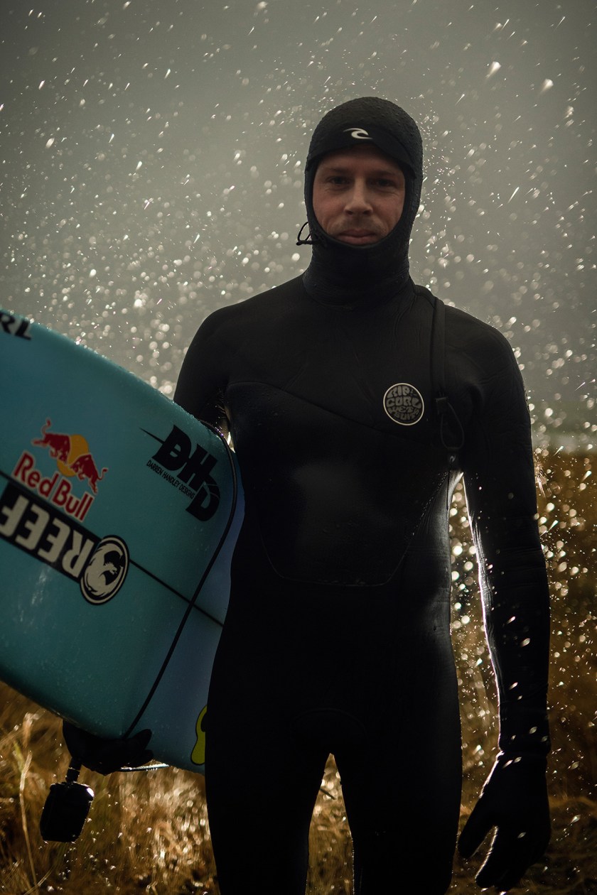 Surfer Surfing Under the Northern Lights