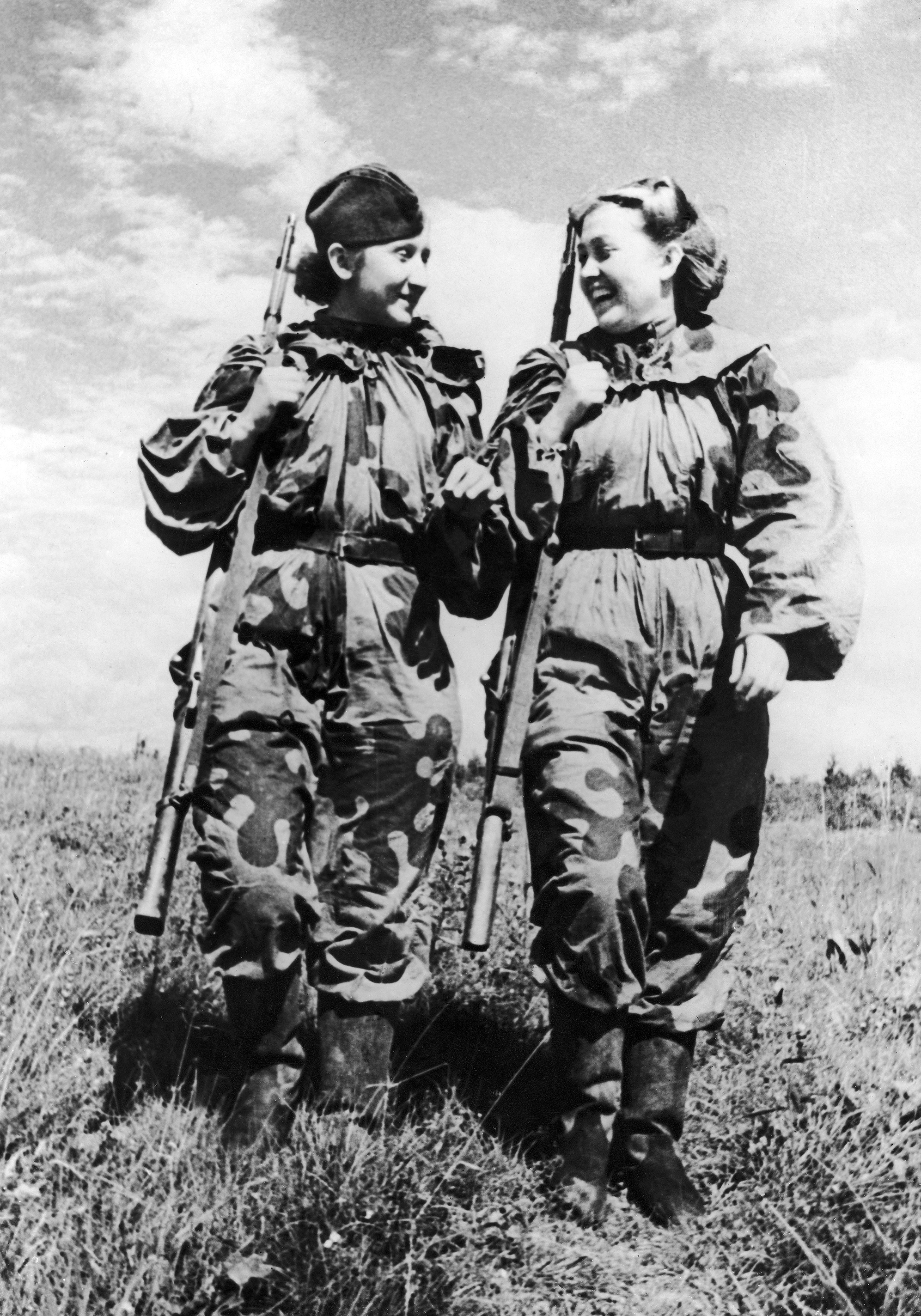 Volunteer women snipers of the Russian Army R. Skrypnikova (right) and O. Bykova returning from a combat assignment during the Second World War on November 21, 1943. (Daily Mirror Library/Mirrorpix/Mirrorpix via Getty Images)