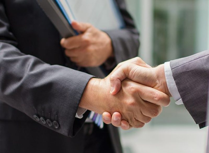 Businessmen shaking hands (Getty Images)