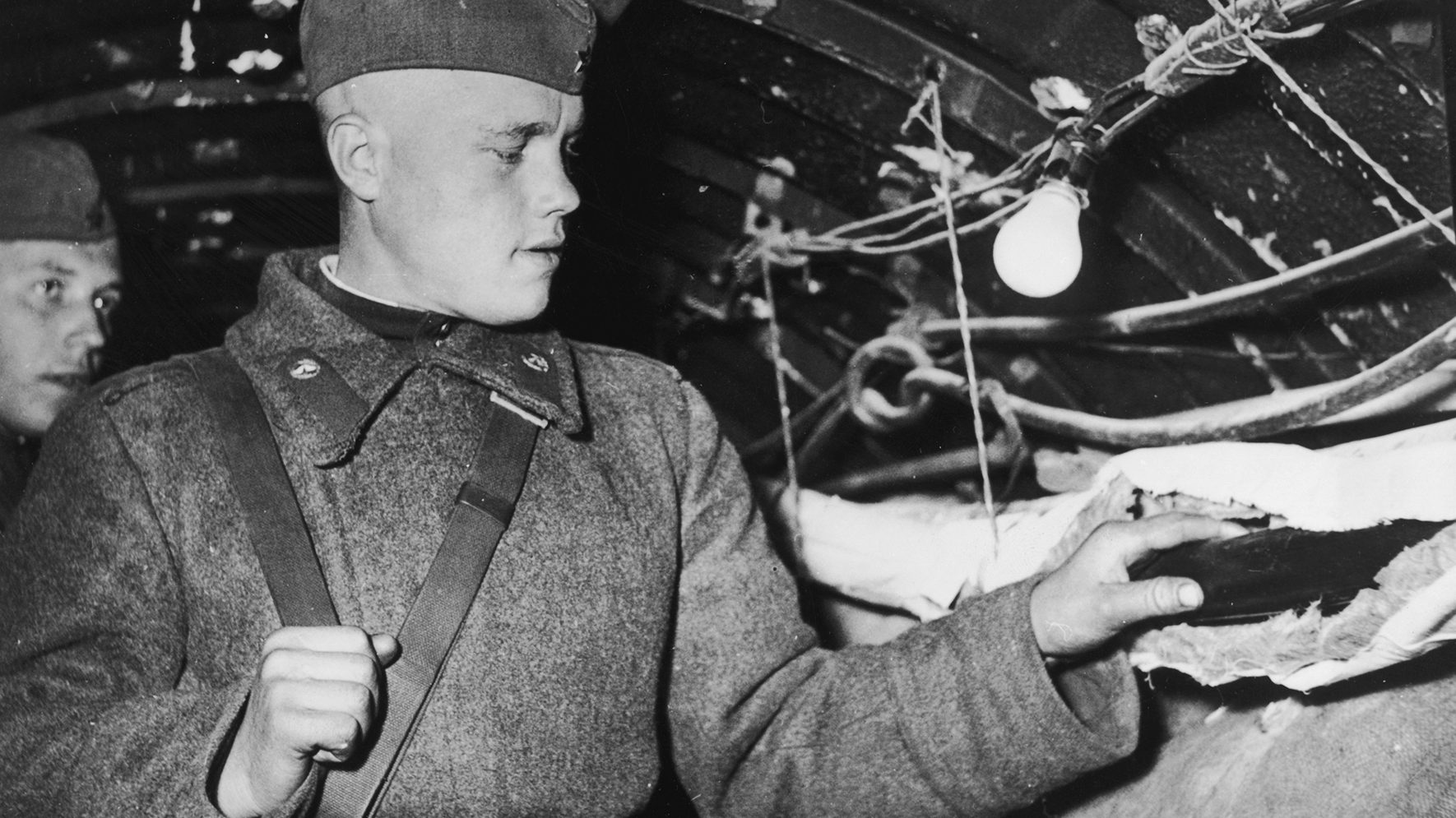 A Soviet soldier inside the 350 yard tunnel extending from the American Sector of Berlin into the Soviet Sector on April 26, 1956. Later admitting to the wiretapping, the CIA said 40,000 hours of telephone conversations were recorded.(Keystone/Getty Images)