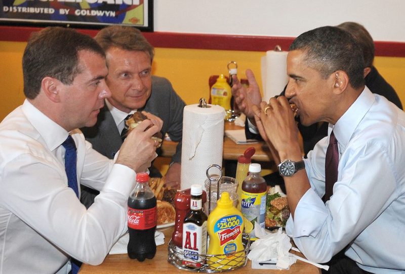US President Barack Obama and Russian President Dmitry Medvedev eat burgers during a lunch at Ray's Hell Burger June 24, 2010 in Arlington, Virginia. Obama and Medvedev dodged the formality of a US-Russia summit Thursday, slipping out of the White House to visit one of the US leader's favorite burger joints.The two leaders will hold a joint press conference later June 24 at the White House. AFP PHOTO/Mandel NGAN (Photo credit should read MANDEL NGAN/AFP/Getty Images)