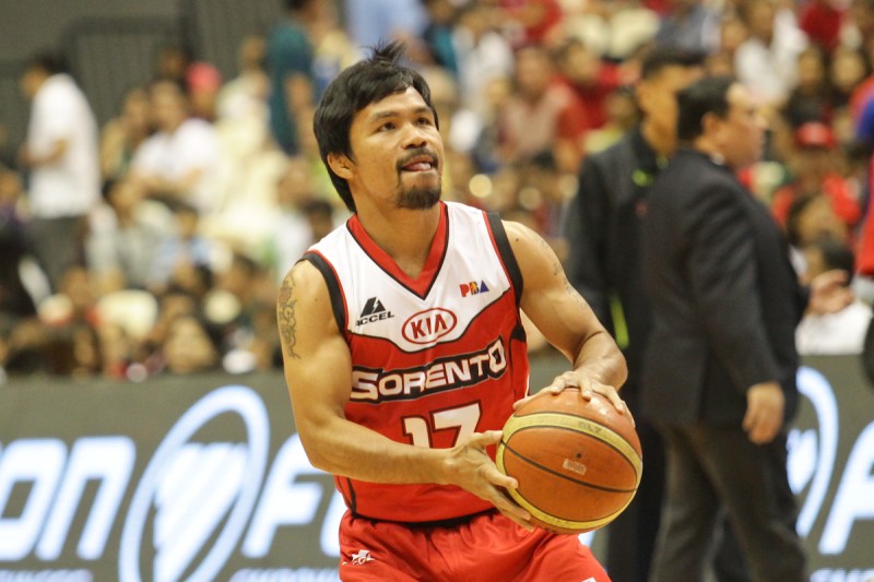 Bocaue, Bulacan Philippines - Manny Pacquiao of Kia warms up before their game against Blackwater on the 40th season opening of the Philippine Basketball Association (PBA) on October 19, 2014. Kia won 80-66 with the Filipino boxing champion and politician playing over 6 minutes with 2 turnovers and 1 foul. (Photo by Photo by Mark Cristino/NurPhoto)