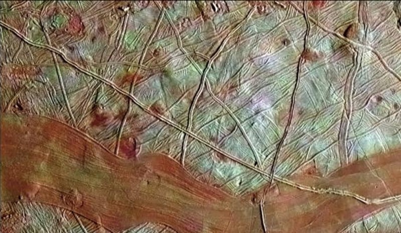 This colorized image of Jupiter's moon Europa is a product of clear-filter grayscale data from one orbit of NASA's Galileo spacecraft, combined with lower-resolution color data taken on a different orbit. The blue-white terrains indicate relatively pure water ice, whereas the reddish areas contain water ice mixed with hydrated salts, potentially magnesium sulfate or sulfuric acid (NASA/JPL-Caltech/SETI Institute)