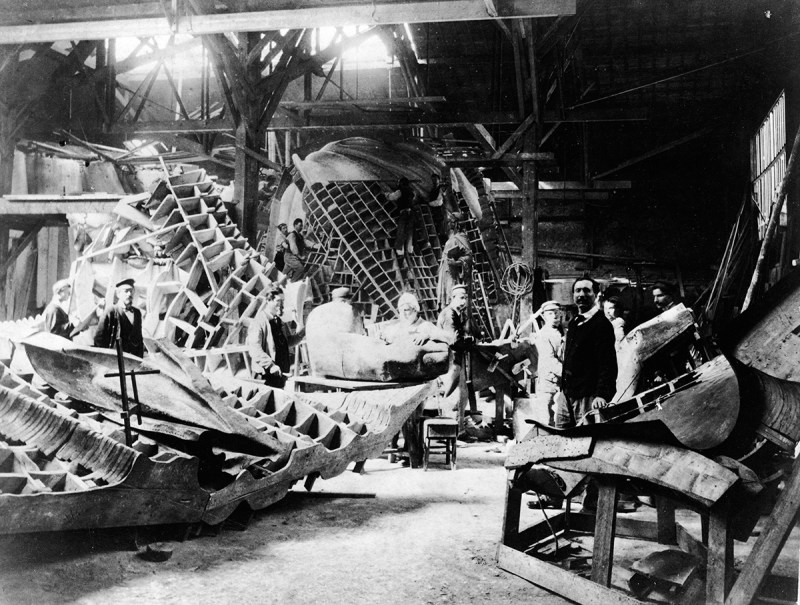View of portions of the Statue of Liberty during its construction in the workshop of French sculptor Frederic Auguste Bartholdi, Paris, France, circa 1880. Bartholdi stands at left. (Photo by Musee Bartholdi/Authenticated News/Getty Images)