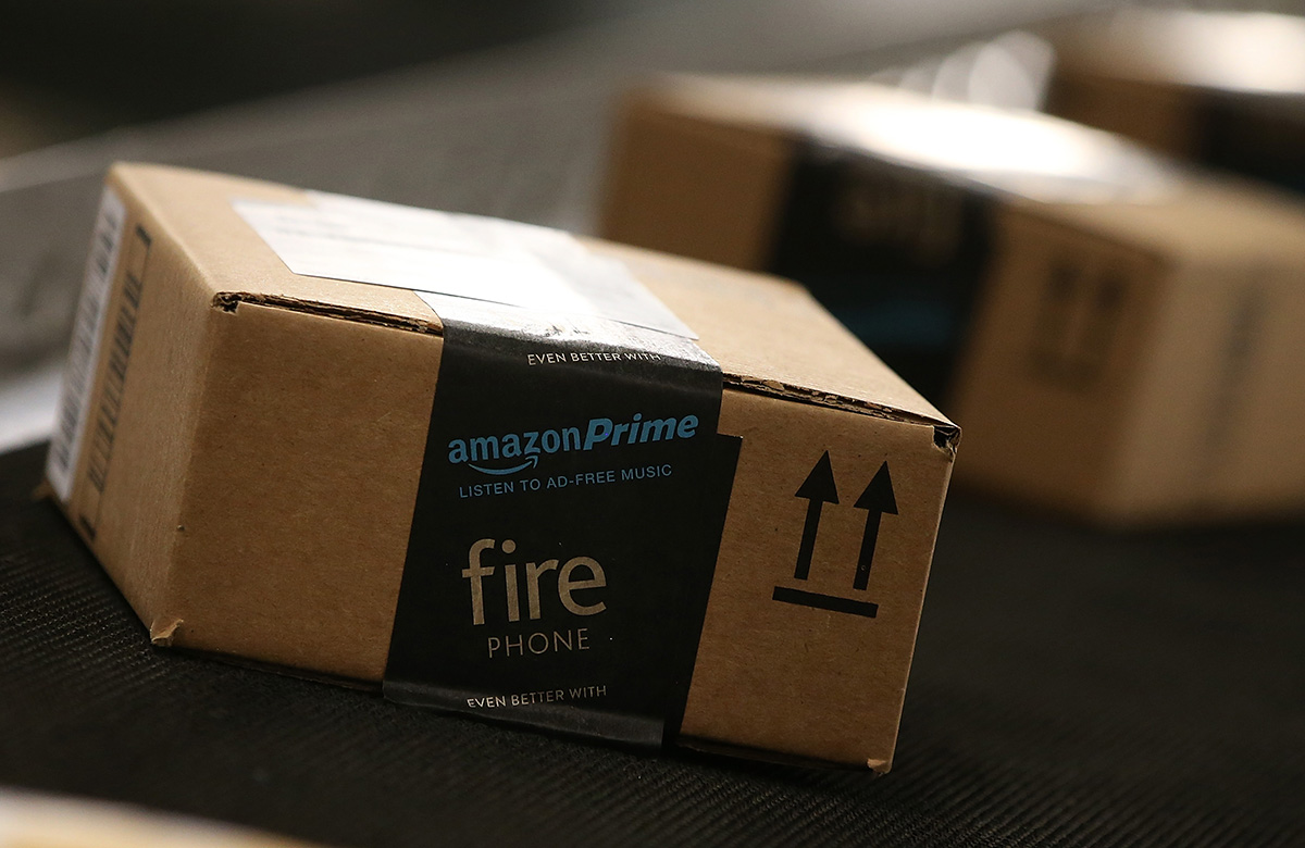 TRACY, CA - JANUARY 20:  Boxes move along a conveyor belt at an Amazon fulfillment center on January 20, 2015 in Tracy, California. Amazon officially opened its new 1.2 million square foot fulfillment center in Tracy, California that employs more than 1,500 full time workers as well as 3,000 Kiva robots that can fetch merchandise for workers and are capable of lifting up to 750 pounds. Amazon is currently using 15,000 of the robots spread over 10 fulfillment centers across the country.  (Photo by Justin Sullivan/Getty Images)