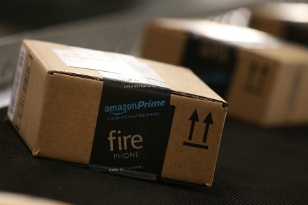 TRACY, CA - JANUARY 20:  Boxes move along a conveyor belt at an Amazon fulfillment center on January 20, 2015 in Tracy, California. Amazon officially opened its new 1.2 million square foot fulfillment center in Tracy, California that employs more than 1,500 full time workers as well as 3,000 Kiva robots that can fetch merchandise for workers and are capable of lifting up to 750 pounds. Amazon is currently using 15,000 of the robots spread over 10 fulfillment centers across the country.  (Photo by Justin Sullivan/Getty Images)