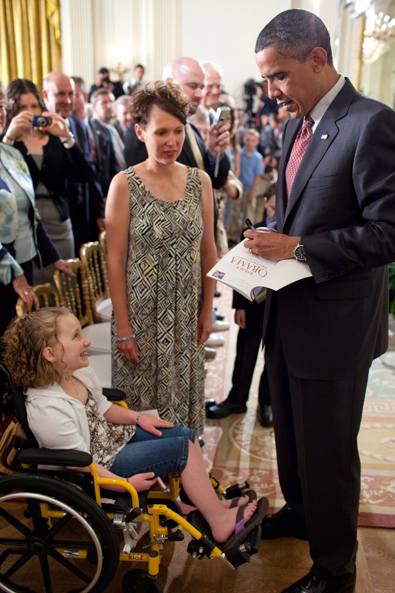 President Barack Obama talks with Amy Wilhite and daughter Taylor, who has Acute Myeloid Leukemia (AML), a fast-growing cancer of the blood and bone marrow, following his remarks on the 90-day anniversary of the signing of the Affordable Care Act, in the East Room of the White House, June 22, 2010. (Official White House Photo by Pete Souza) 
