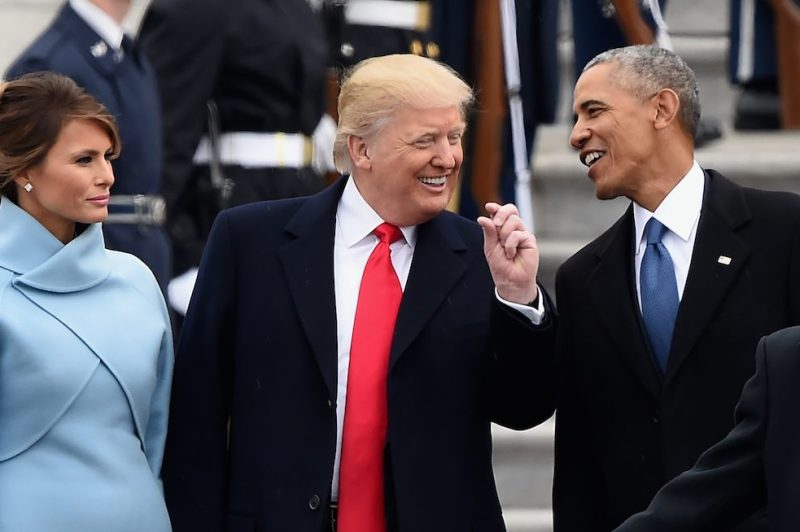 US First Lady Melania Trump looks on as US President Donald Trump and former President Barack Obama talk on the East front steps of the US Capitol after inauguration ceremonies on January 20, 2017 in Washington, DC. / AFP / Robyn BECK (Photo credit should read ROBYN BECK/AFP/Getty Images)