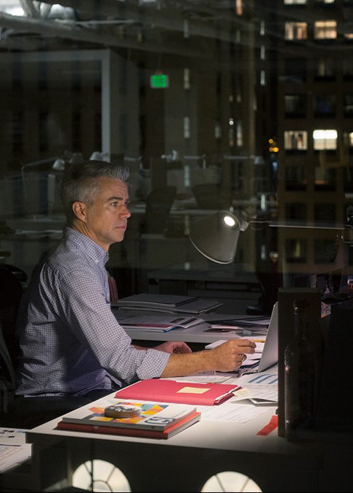 Businessman working late in office (Getty Images)