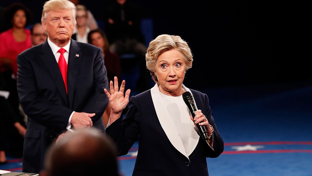 ST LOUIS, MO - OCTOBER 09:  Democratic presidential nominee former Secretary of State Hillary Clinton (R) speaks as Republican presidential nominee Donald Trump listens during the town hall debate at Washington University on October 9, 2016 in St Louis, Missouri. This is the second of three presidential debates scheduled prior to the November 8th election.  (Photo by Rick Wilking-Pool/Getty Images)