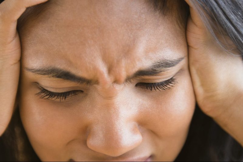 Mixed race woman thinking