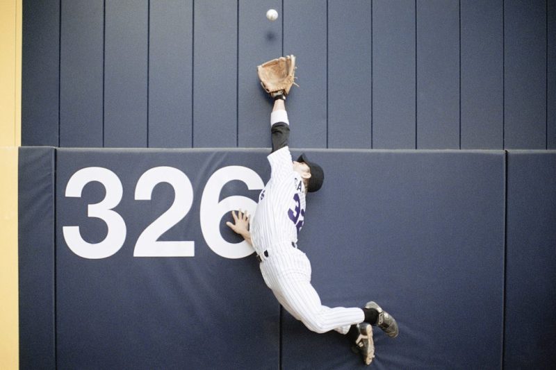 Baseball Outfielder Leaping for Fly Ball ca. 2003