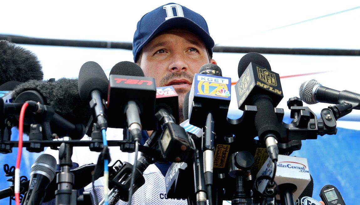 Dallas Cowboys quarterback Tony Romo is behind a wall of microphones during his media availability after the team's morning walk through during training camp in Oxnard, Calif., on Thursday, July 30, 2015. (Paul Moseley/Fort Worth Star-Telegram/TNS via Getty Images)