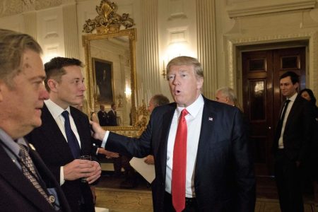 Trump advisor Steve Bannon (L) watches as US President Donald Trump greets Elon Musk, SpaceX and Tesla CEO, before a policy and strategy forum with executives in the State Dining Room of the White House February 3, 2017 in Washington, DC. / AFP / Brendan Smialowski        (Photo credit should read BRENDAN SMIALOWSKI/AFP/Getty Images)